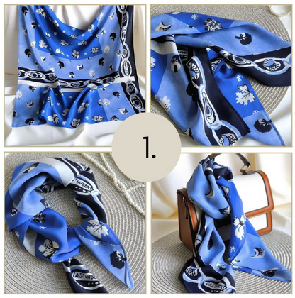 Blue patterned scarf displayed in various poses on a textured surface.